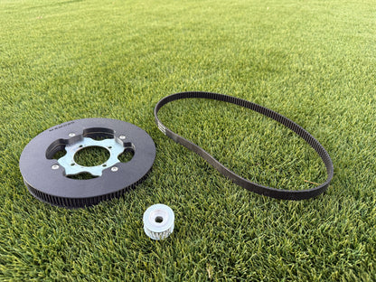 The full Mxmods standars swingarm belt drive kit, on grass background
