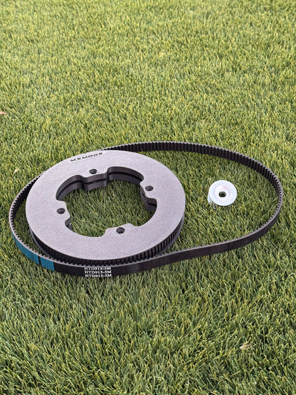 Gear and belt on a grassy surface